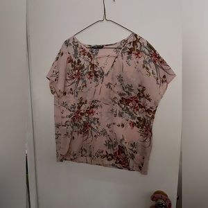 Light pink floral sleeveless top.